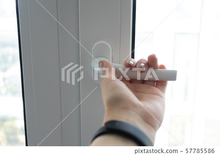Female hand open plastic pvc white window to get Female hand open plastic pvc white window to get 57785586