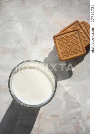Glass of milk and butter cookies on the kitchen 57785722