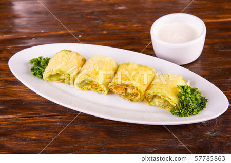 The fried vegetable marrows with garlic and greens, move with sour cream 57785863