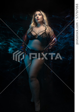 Plus size model in black lingerie. Fog effect. Plus size model in black lingerie. Fog effect. 57787068