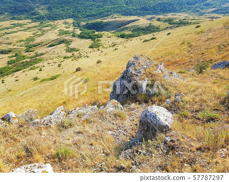 Big stones on a hillside 57787297