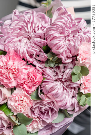 Closeup mixed flowers in bouquet. the work of the florist at a flower shop. Delicate Pastel color Closeup mixed flowers in bouquet. the work of the florist at a flower shop. Delicate Pastel color 57789385