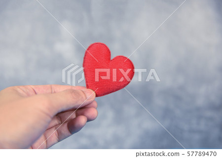 heart on hand for philanthropy concept - man 57789470