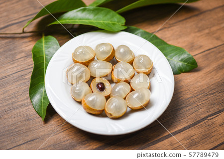 Longan fresh tropical fruit and green leaf in 57789479