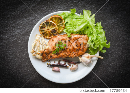chicken breast grilled with garlic chilli herbs chicken breast grilled with garlic chilli herbs 57789484