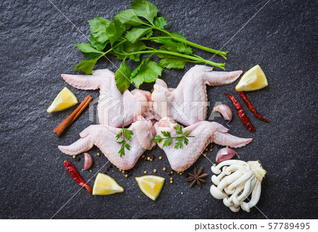 raw chicken wings with lemon chilli herbs and raw chicken wings with lemon chilli herbs and 57789495