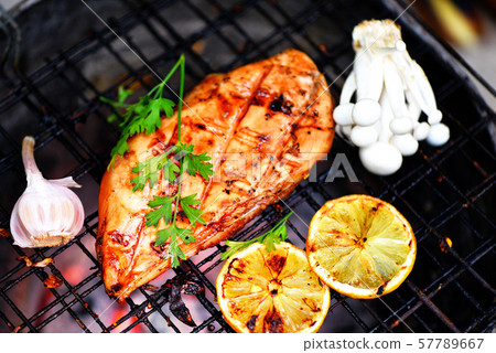 chicken breast grilled with garlic chilli herbs chicken breast grilled with garlic chilli herbs 57789667