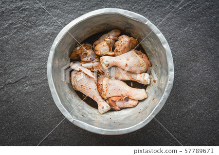 raw chicken with legs and wings with herbs and raw chicken with legs and wings with herbs and 57789671