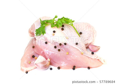 raw chicken breast with herbs and spices isolated raw chicken breast with herbs and spices isolated 57789684