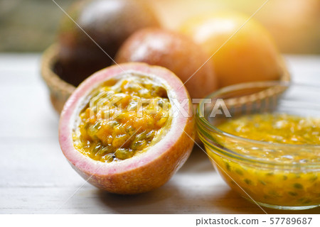 Fresh Passion fruit juice on wooden table Fresh Passion fruit juice on wooden table 57789687
