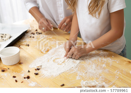 Heart of flour on wooden desk painted by a child 57789961