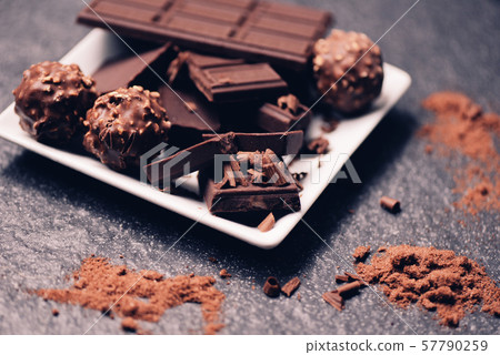 chocolate bar and chocolate ball on white plate on chocolate bar and chocolate ball on white plate on 57790259