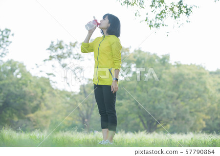 Women exercising in the park 57790864