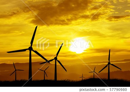Windmill silhouettes at sunset as renewable energy Windmill silhouettes at sunset as renewable energy 57790980