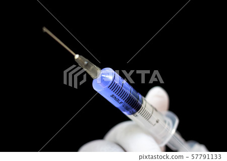 Antivirus syringe in a hand in medical gloves, Antivirus syringe in a hand in medical gloves, 57791133