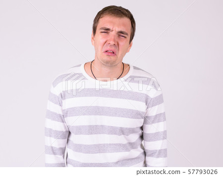 Portrait of sad man looking depressed and crying Portrait of sad man looking depressed and crying 57793026
