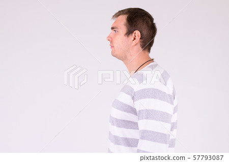Profile view of man against white background Profile view of man against white background 57793087