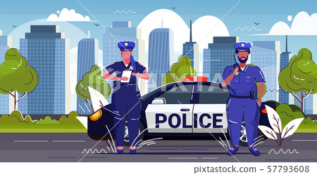 policeman using walkie-talkie policewoman writing fine report mix race police officers standing near policeman using walkie-talkie policewoman writing fine report mix race police officers standing near 57793608