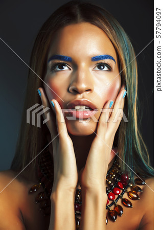 young pretty modern african american girl with bright fashion makeup and ethnic jewelry 57794097