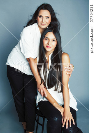cute pretty teen daughter with mature mother hugging, fashion style brunette, lifestyle people cute pretty teen daughter with mature mother hugging, fashion style brunette, lifestyle people 57794251