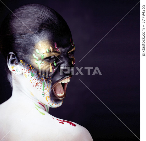 woman with creative makeup closeup like drops of colors, facepaint close up halloween woman with creative makeup closeup like drops of colors, facepaint close up halloween 57794255