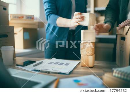 people are working at warehouse people are working at warehouse 57794282