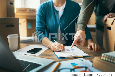 people are working at warehouse people are working at warehouse 57794283