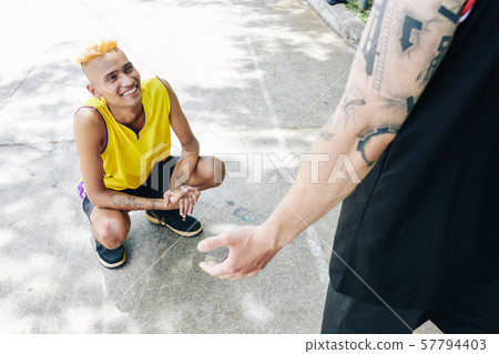 Sportsman listening to friends story 57794403