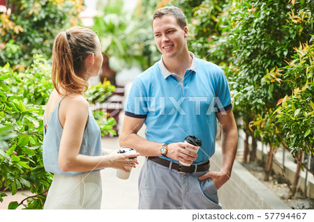 Handsome man flirting with woman Handsome man flirting with woman 57794467