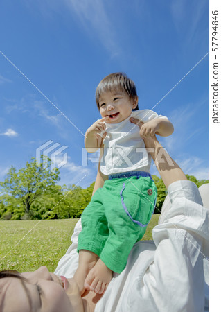 Mother and son playing in the park 57794846