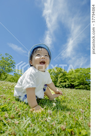 Mother and son playing in the park 57794864