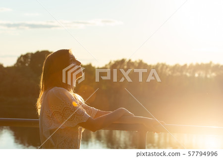 Vintage photo of relaxing young woman in nature. Vintage photo of relaxing young woman in nature. 57794996