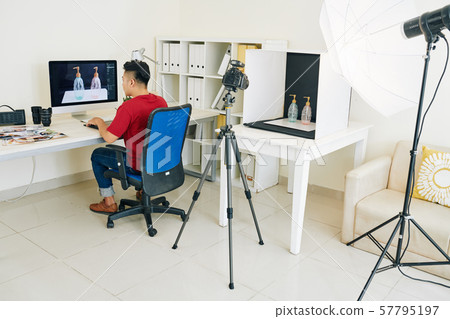 Photographer working on commercial project Photographer working on commercial project 57795197