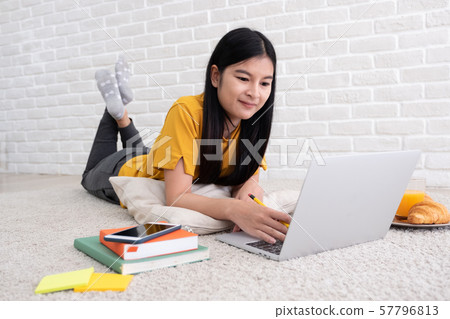 Asian female freelancer working on laptop computer Asian female freelancer working on laptop computer 57796813