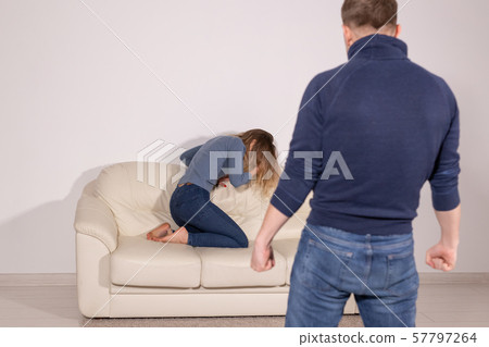 alcoholic, domestic violence and abuse concept - man gets drunk at home and takes his anger at his alcoholic, domestic violence and abuse concept - man gets drunk at home and takes his anger at his 57797264