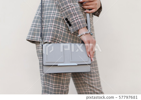 Woman with a fashionable bag 57797681