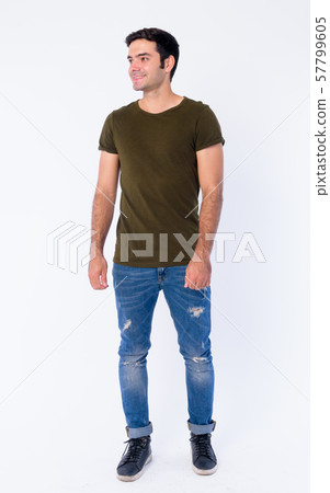 Full body of happy young handsome Persian man thinking Full body of happy young handsome Persian man thinking 57799605