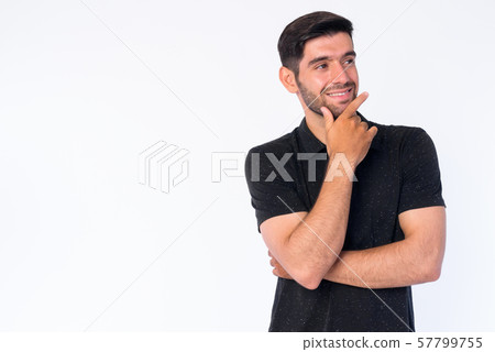 Portrait of happy young bearded Persian man thinking and looking up 57799755