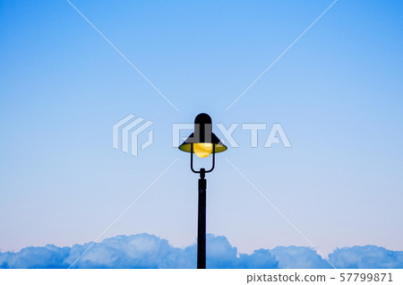 Vintage retro light pole with blue sky background Vintage retro light pole with blue sky background 57799871
