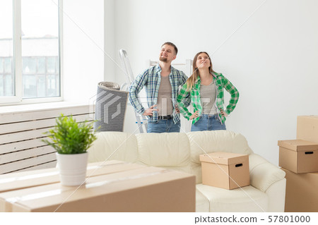 Family, new apartment and relocation concept - Young couple moving in new house 57801000