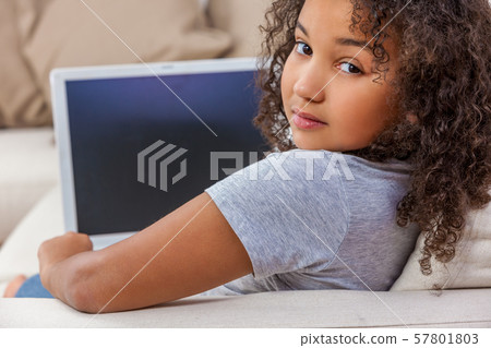 Mixed Race African American Girl Child Using Laptop Computer for Social Media 57801803