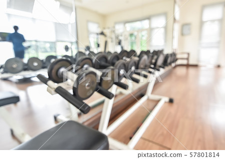 Blur gym background fitness center or health club with blurry sports exercise equipment for aerobic workout and bodybuilding 57801814