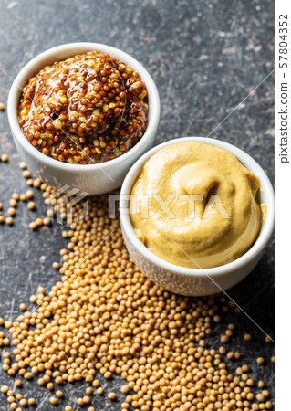 Yellow mustard and whole grain mustard. Yellow mustard and whole grain mustard. 57804352