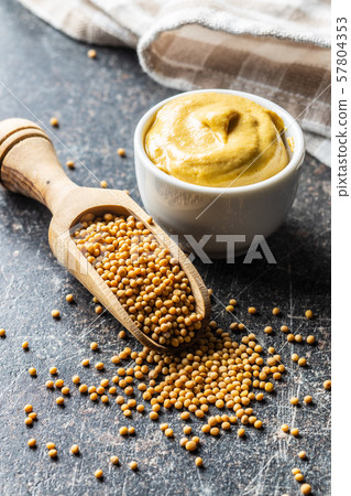 Yellow mustard and mustard seeds. Yellow mustard and mustard seeds. 57804353