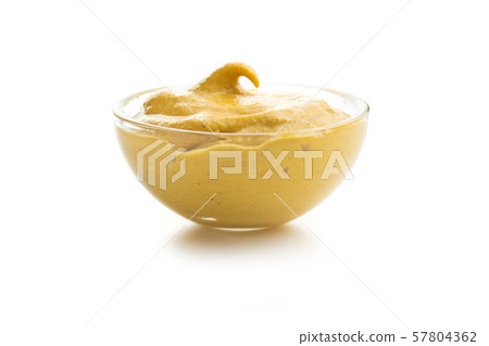 Yellow mustard in bowl 57804362