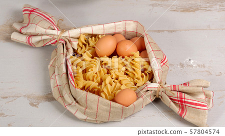 Pasta in a towel on a wooden table Pasta in a towel on a wooden table 57804574