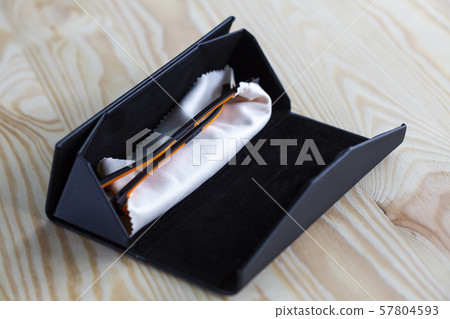 Eyeglasses with microfibre cleaning cloths in black box, Close up & Macro shot, Selective focus 57804593