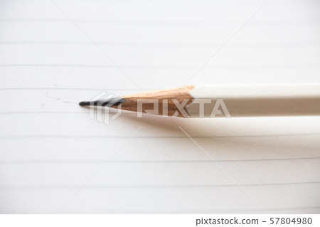 Hand writing letter on white paper background, A white pencil, Close up & Macro shot, Selective focus, Stationery concept Hand writing letter on white paper background, A white pencil, Close up & Macro shot, Selective focus, Stationery concept 57804980