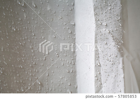 Wet white wrinkled shower curtain with water drops, steam shower on white background, Light and shadow, Bathroom concept Wet white wrinkled shower curtain with water drops, steam shower on white background, Light and shadow, Bathroom concept 57805853