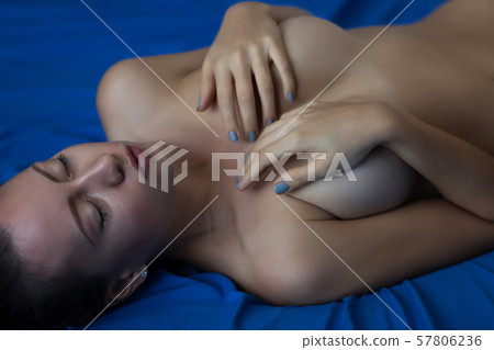 Sexy naked woman lying on back in thongs Sexy naked woman lying on back in thongs 57806236